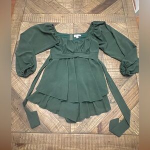 She + Sky dark green long-sleeve romper with a tiered skirt and waist tie.